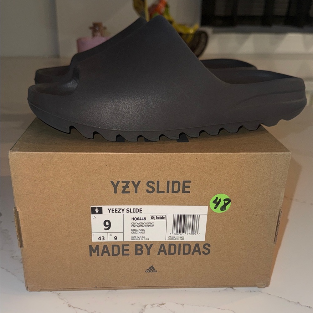100% Authentic Adidas ONYX Yeezy Slides Size 9 Used ONCE ! NO DAMAGES .